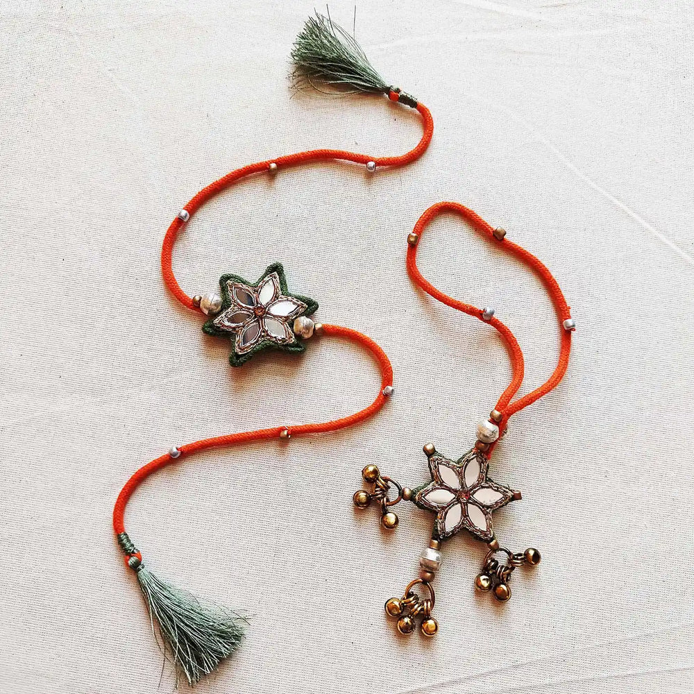 Handmade Mirror Work And Ghungroo Bhaiya Bhabhi Rakhi With Roli Chawal Set Of 2 - Pair Display on Cloth Surface (2)