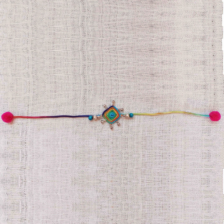 Handmade Dori Work Peacock And Ghungroo Bhaiya Bhabhi Rakhi With Roli Chawal Set Of 2 - Flat lay of full necklace length