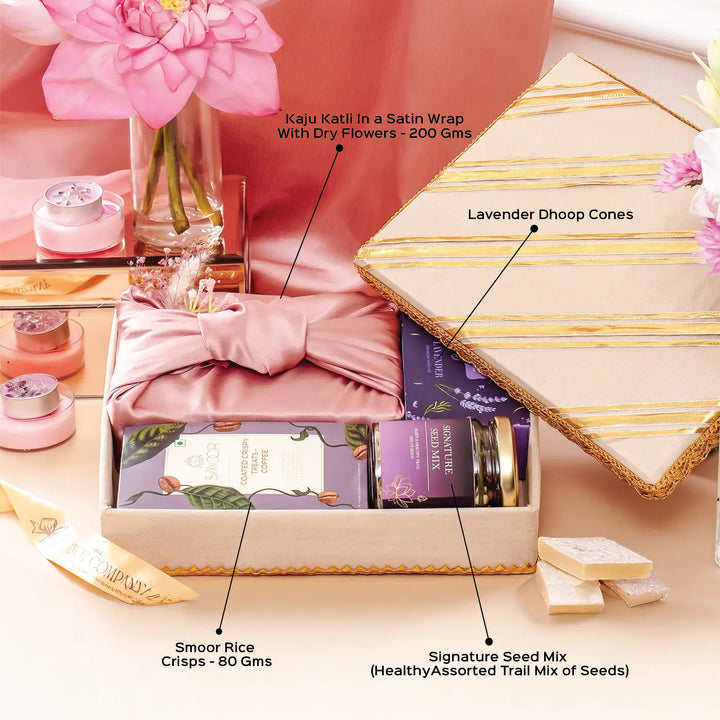 Festive Limelight in Lilac Gift Hamper | Includes 1 Kaju Katli Box, 1 Lavender Dhoop Cones Box, 1 Smoor Rice Crisps, 1 Signature Seed Mix, 1 Gift Box