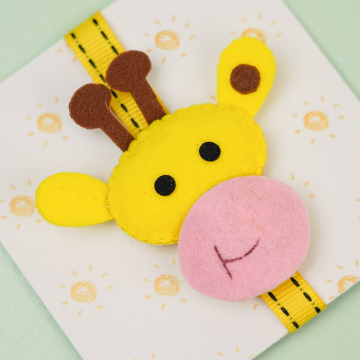 Handmade Giraffe Theme Felt Kids Rakhi With Roli Chawal - Close-up of Giraffe Face