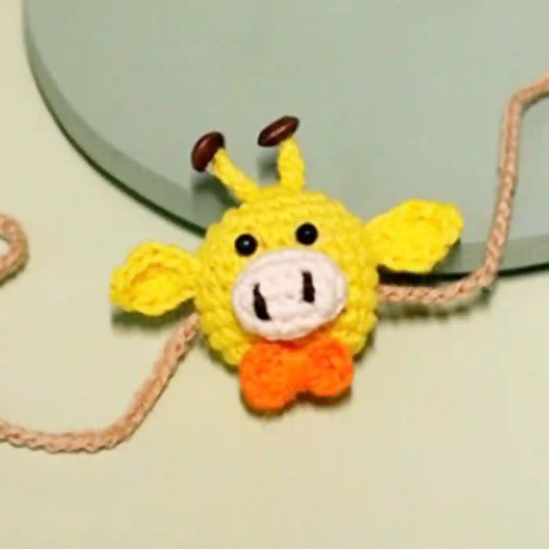 Handmade Crochet Giggling Giraffe Kids Rakhi With Roli Chawal - Close-up of Crochet Detail