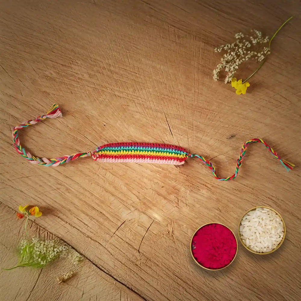 Handmade Crochet Multicolour Band Rakhi With Roli Chawal - Top View with Decorative Items