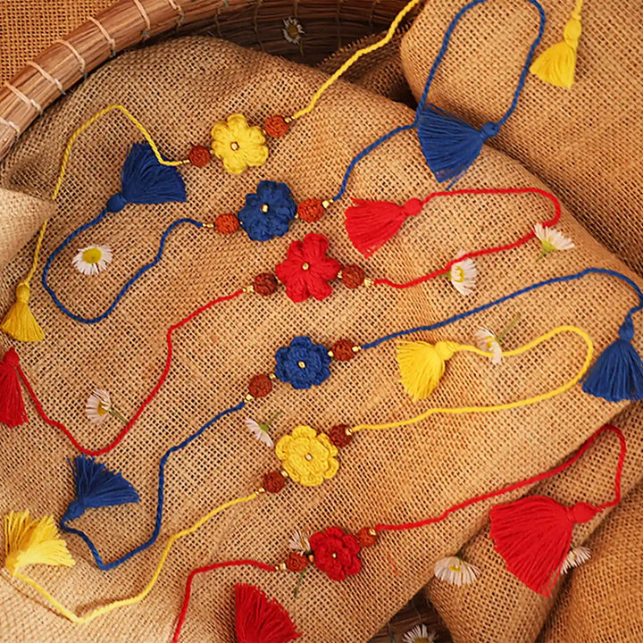 Handmade Crochet Flower And Rudraksh Rakhi With Roli Chawal Set Of 6 - Assorted Bracelets with Props