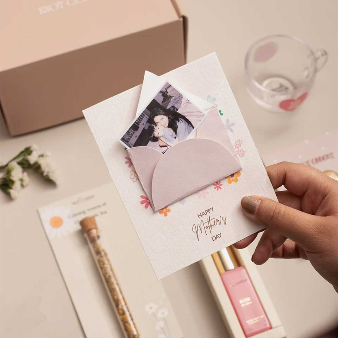 Photo Personalized Celebrating Mom’s Love Gift Hamper | Includes 1 Perfume, 4 Heart-Shaped Baked Cookies, 1 “Love You Mom” Glass Tea Cup, 1 Mother’s Day Card, 1 Chamomile Tea Glass Tube, 1 All Things Nice Gift Box