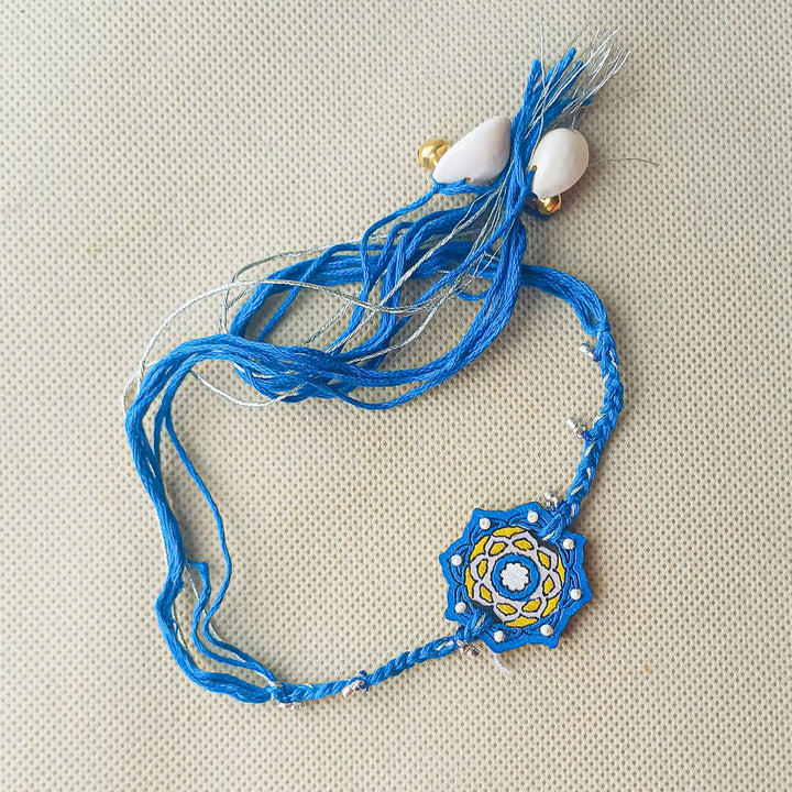 Handmade Blue Jaipuri Ghungroo And Shell Beads Wooden Lumba Rakhi For Bhabhi With Roli Chawal - Full Necklace Layout