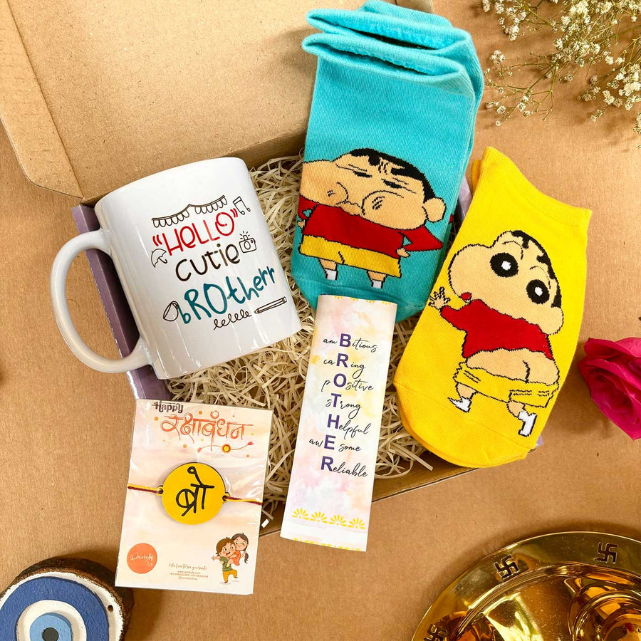 Shinchan Theme Rakhi Hamper For Brother Includes 1 Rakhi 2 Pair Socks 1 Chocolate And 1 Mug - Gift Set Display