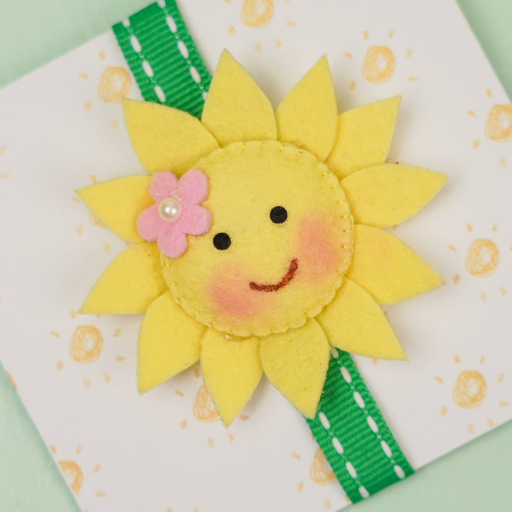 Handmade Sunflower Theme Felt Kids Rakhi With Roli Chawal - Close-up of Flower Decoration