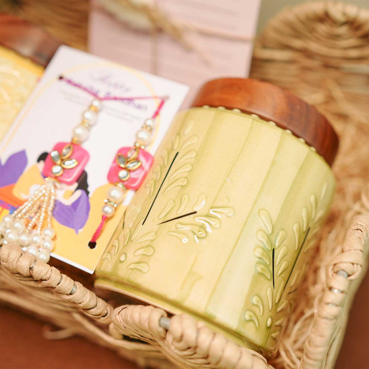 Personalized Handmade Rakhi Hamper Includes 1 Basket 2 Jars 2 Rakhis 1 Roli Chawal And 1 Message Card - Close-up on Green Jar Detail