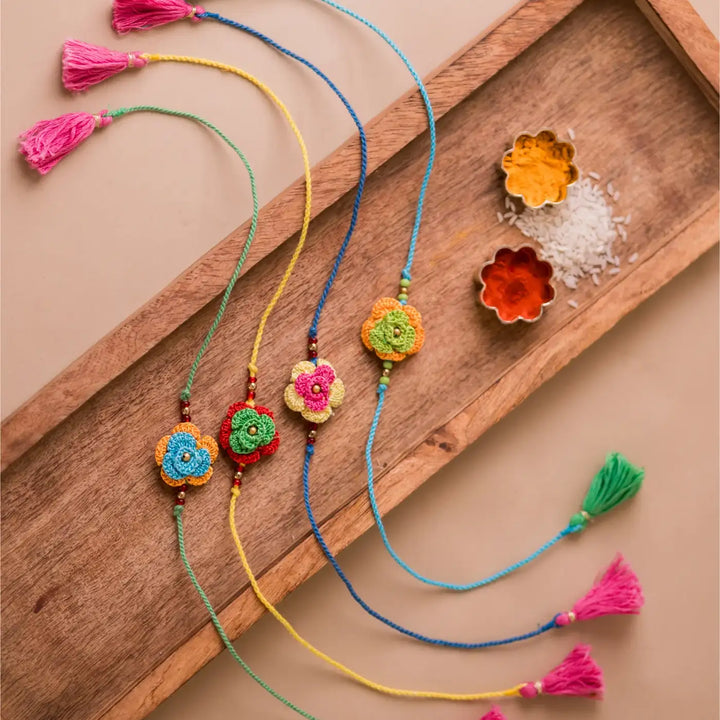 Handmade Crochet Multicolor Roses Rakhi With Roli Chawal Set Of 4 - Full Set with Tassels and Spices