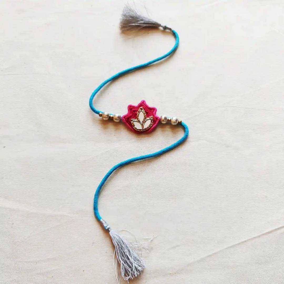 Handmade Mirror Work Lotus Bhaiya Bhabhi Rakhi With Roli Chawal Set Of 2 - Close-up Smaller Piece