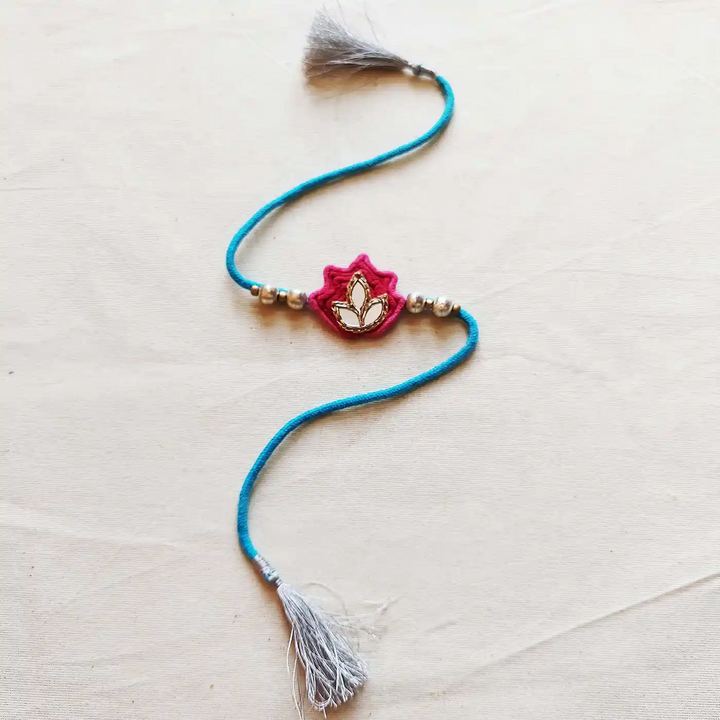 Handmade Mirror Work Lotus Bhaiya Bhabhi Rakhi With Roli Chawal Set Of 2 - Close-up Smaller Piece