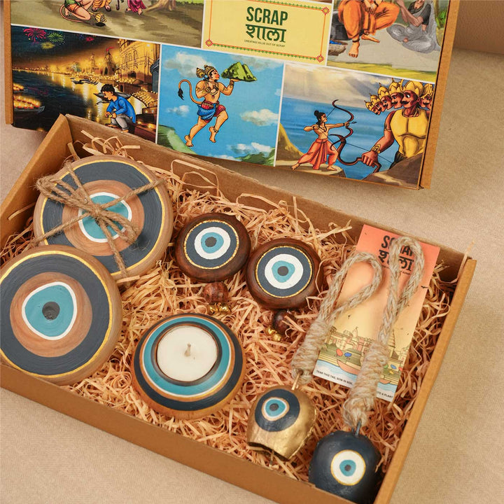 Handmade Divya Drishti Gift Hamper | Includes Evil Eye Door Hanging, Evil Eye Coasters, Evil Eye Candle Stand, Evil Eye Bell Hangings, Seed Card And Outer Box