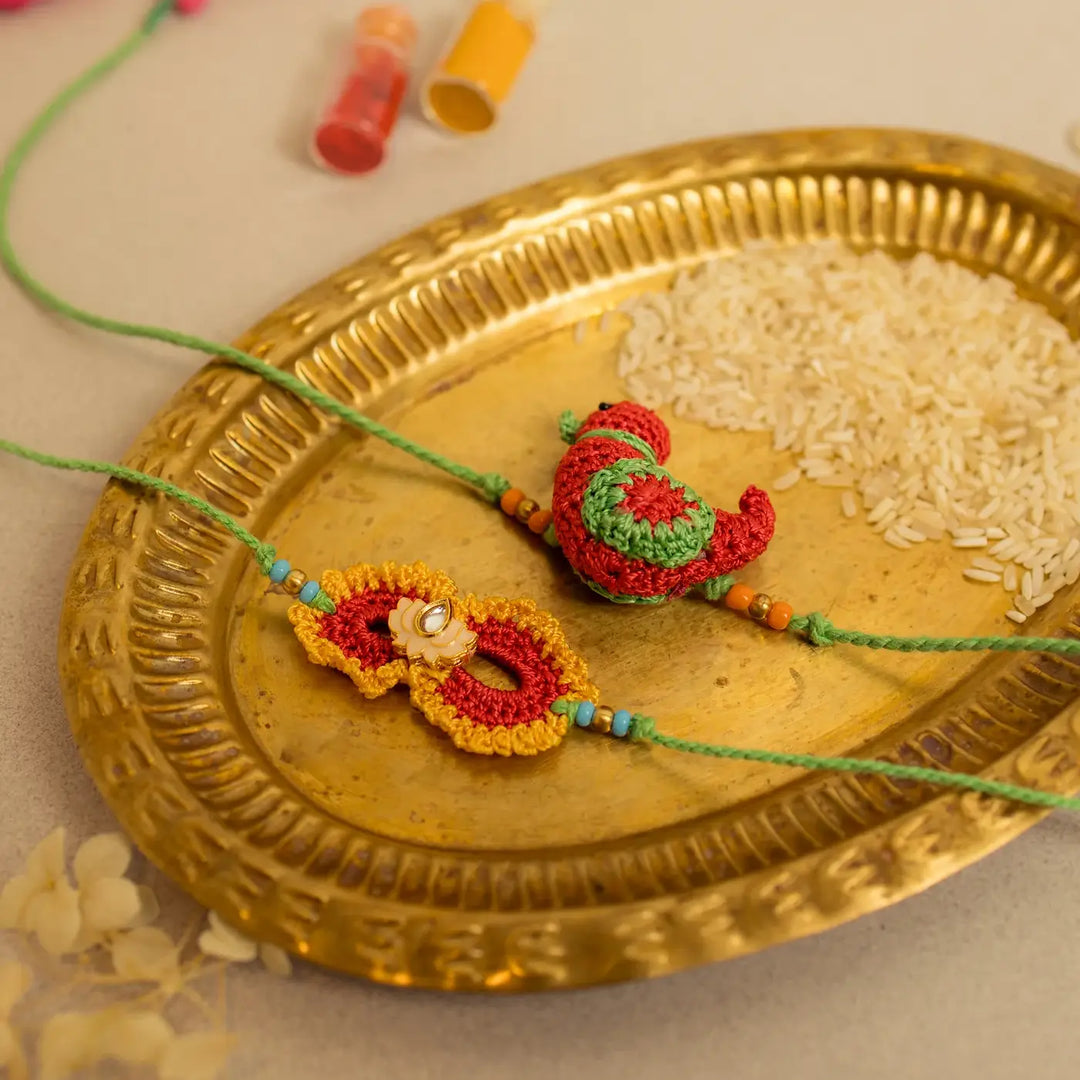 Handmade Crochet Paakhi And Phool Rakhi With Roli Chawal Set Of 2 - Detailed view of Rakhi textures