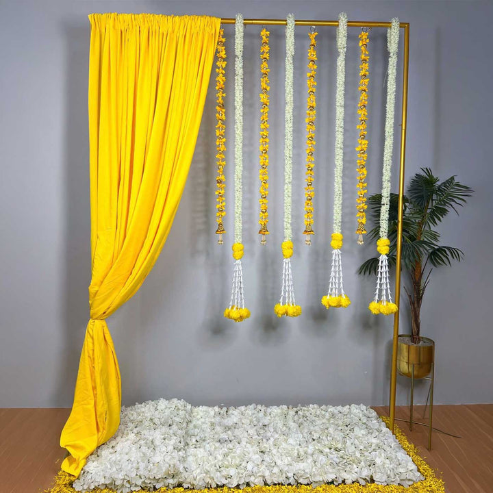 Traditional Yellow Backdrop Decor Kit With Drape, Yellow & White Tassels And Jasmine-Marigold Garlands