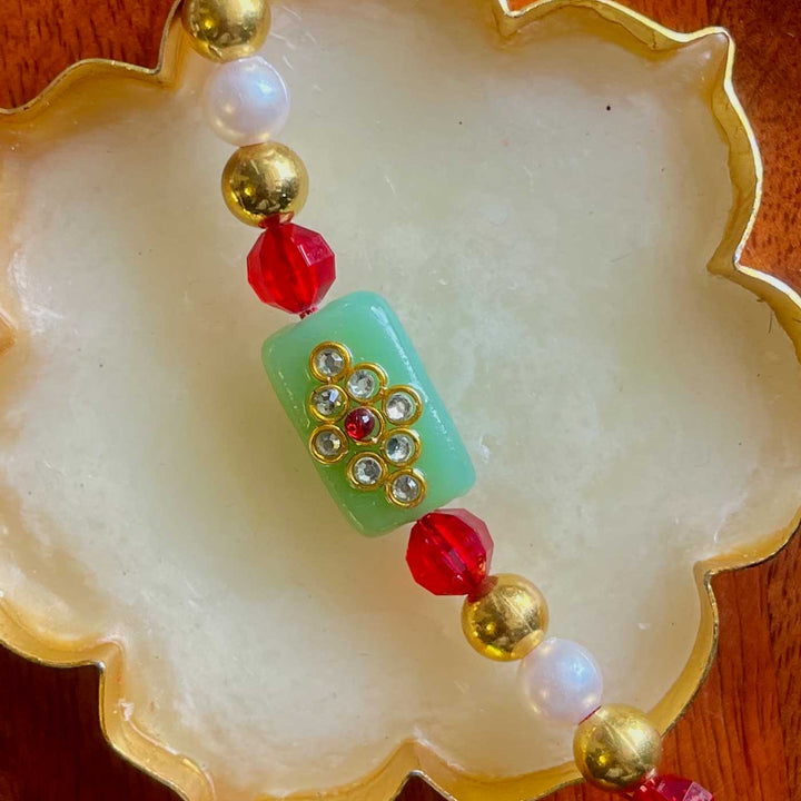 Handmade Green And Pink Design Pearl And Stone Bhaiya Bhabhi Rakhi - Close-up of Green Bead Detail