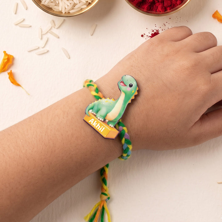 Personalized Reusable Green Dino MDF Wood Rakhi With Roli Chawal