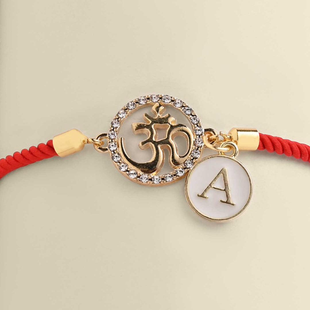 Personalized Handmade Om Design Monogram Metal Rakhi - Close-up of Pendant and Charm