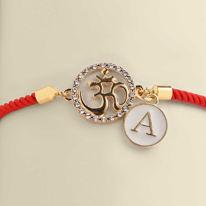 Personalized Handmade Om Design Monogram Metal Rakhi - Close-up of Pendant and Charm