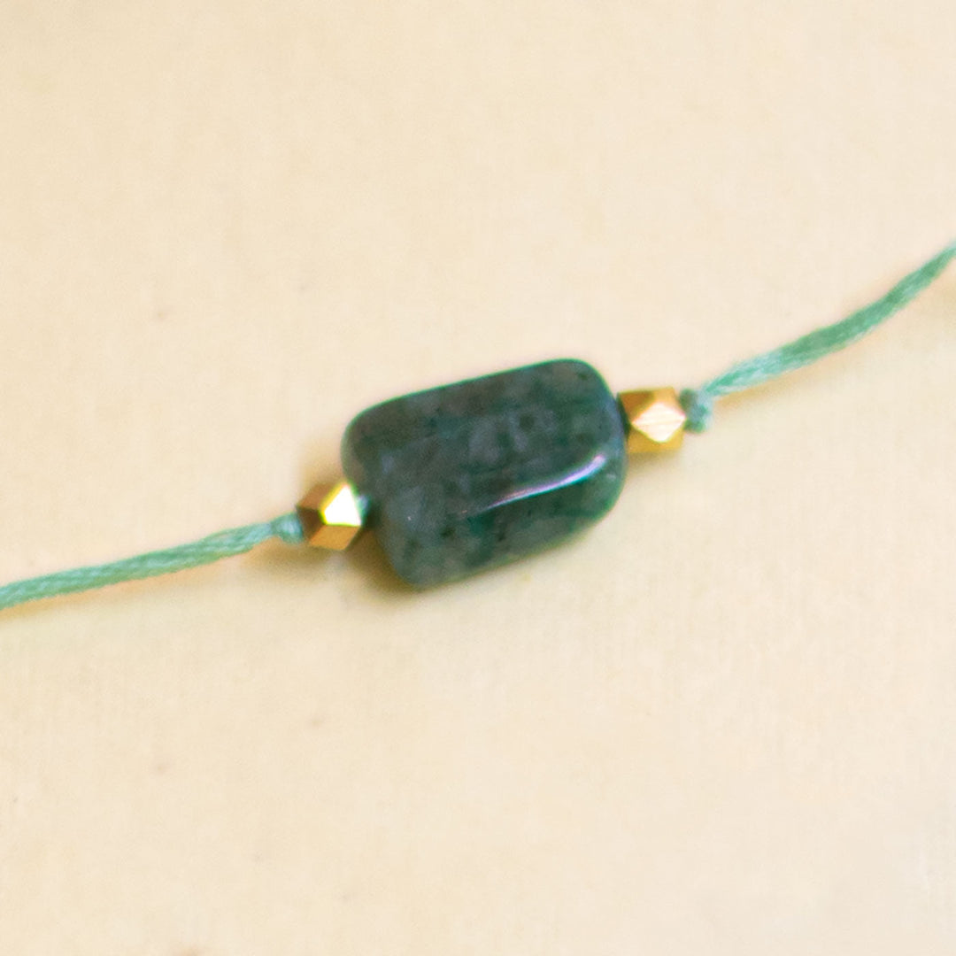 Handmade Reusable White Floral Bliss Bhaiya Bhabhi Rakhi With Roli Chawal - Green Bead Bracelet Close-up