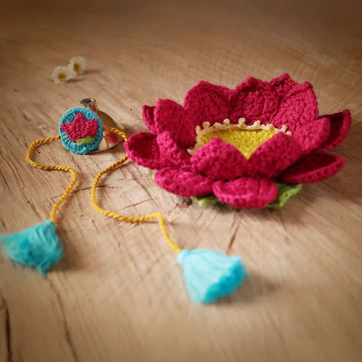 Handmade Crochet Lotus Rakhi And Tealight Holder Combo With Roli Chawal Set Of 2 - Side Angle Showing Flower and String
