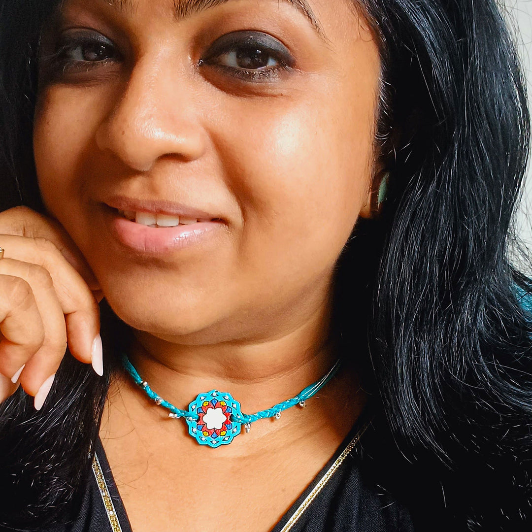 Handmade Blue Jaipuri Ghungroo Shell And Beads Wooden Lumba Rakhi For Bhabhi With Roli Chawal - Model Wearing Necklace Close-up