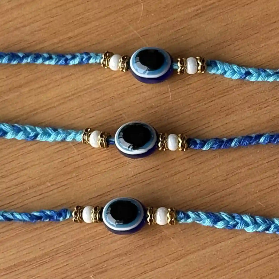 Handmade Beaded Evil Eye Rakhi With Roli Chawal - Close-up of Center Beads