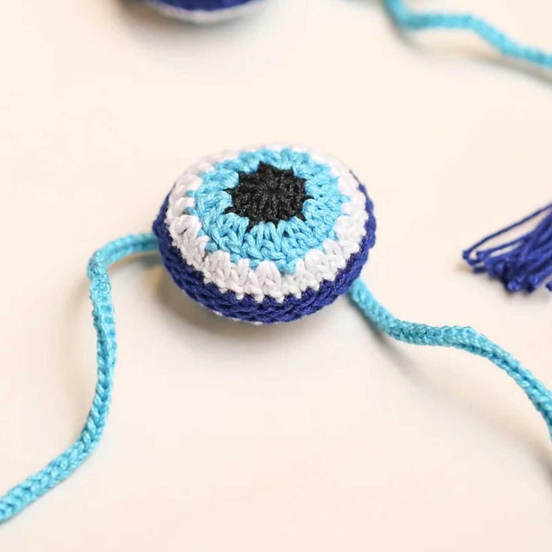 Handmade Crochet Evil Eye Design Cotton Rakhi 10 - Angled Side View