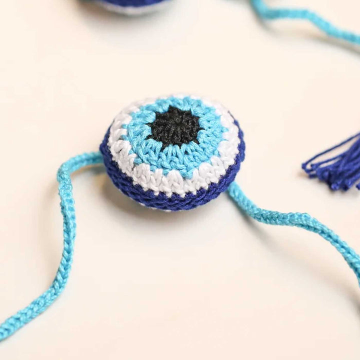 Handmade Crochet Evil Eye Design Cotton Rakhi 10 - Angled Side View