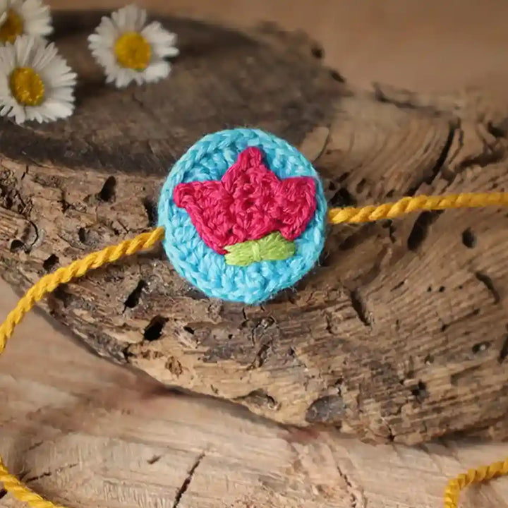 Handmade Crochet Lotus Rakhi And Tealight Holder Combo With Roli Chawal Set Of 2 - Close-up of Embroidered Flower Detail