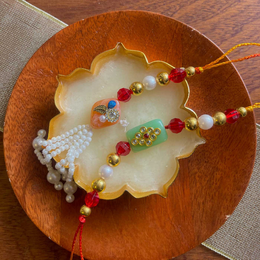 Handmade Green And Pink Design Pearl And Stone Bhaiya Bhabhi Rakhi - Full Product View on Dish
