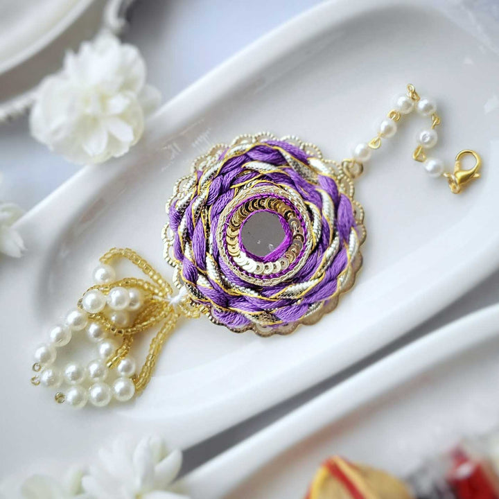 Handmade Mirror Work Braided Rakhi Hamper With Roli Chawal For Bhaiya And Bhabhi - Purple Rakhi Close-up