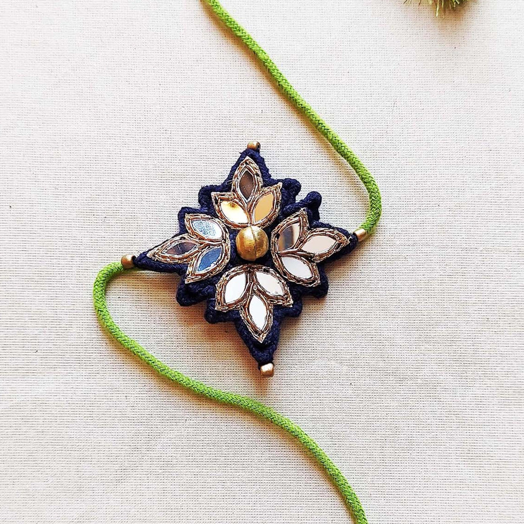 Handmade Mirror Work And Ghungroo Blue Bhaiya Bhabhi Rakhi With Roli Chawal Set Of 2 - Single Piece Detail Close-up