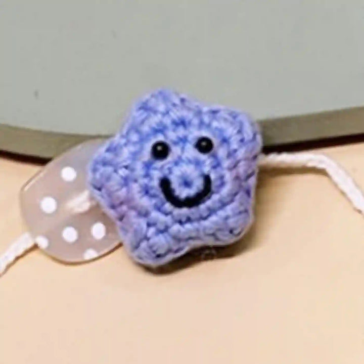 Handmade Crochet Little Star Kids Rakhi With Roli Chawal For Newborns - Blue Star Bracelet Close-up