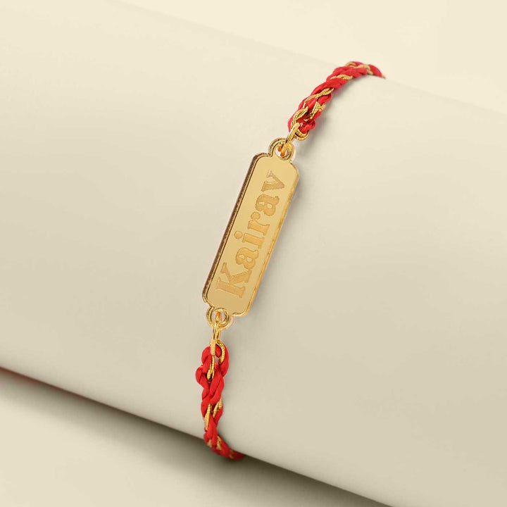 Personalized Handmade Classic Design Acrylic Rakhi - Angled View on Display Stand