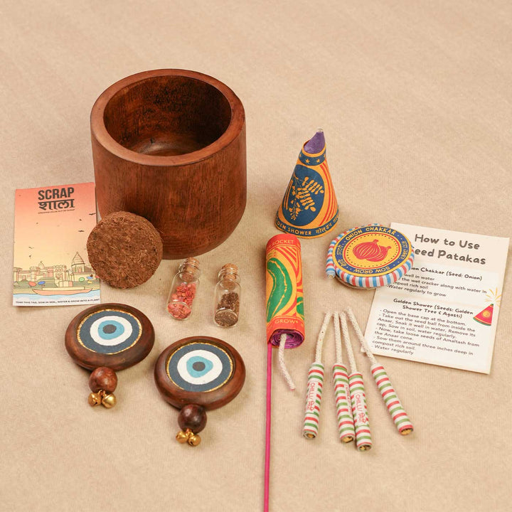 Handmade Prakriti Raksha Gift Hamper | Includes Mango Wooden Planter, Seed Crackers, Seed Jars, Cocopeat, Evil Eye Door Hanging, Cracker Instruction Card, Seed Card And Outer Box