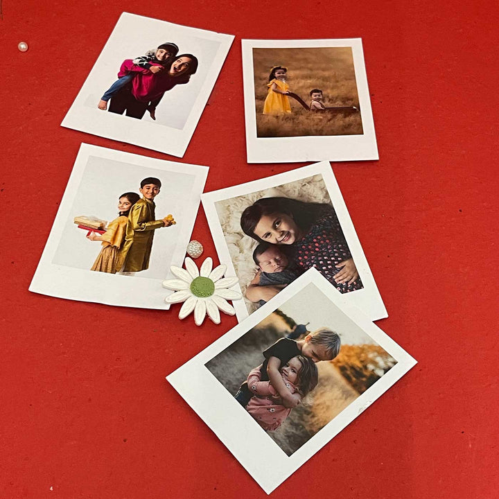 Photo Personalized Handmade Crumbs And Chaos Rakhi Hamper Includes 1 Mug 2 Biscotti 5 Photos 2 Brownies 1 Marble Lotus 1 Chocolate 1 Coffee And 1 Set Bhaiya Bhabhi Rakhi - Set of Polaroid Images