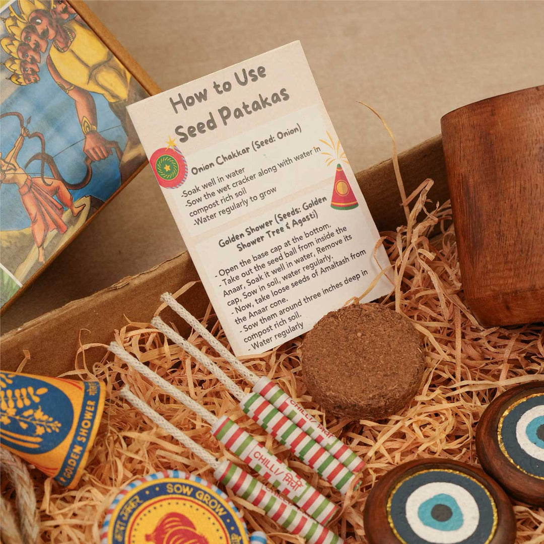 Handmade Samriddhi Gift Hamper | Includes Evil Eye Door Hanging, Evil Eye Bell Hanging, Wooden Planter, Cocopeat, Seed Crackers, Cracker Instruction Card, Seed Card And Outer Box