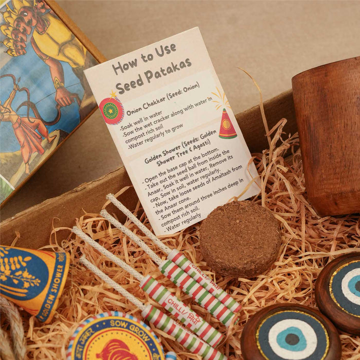 Handmade Samriddhi Gift Hamper | Includes Evil Eye Door Hanging, Evil Eye Bell Hanging, Wooden Planter, Cocopeat, Seed Crackers, Cracker Instruction Card, Seed Card And Outer Box