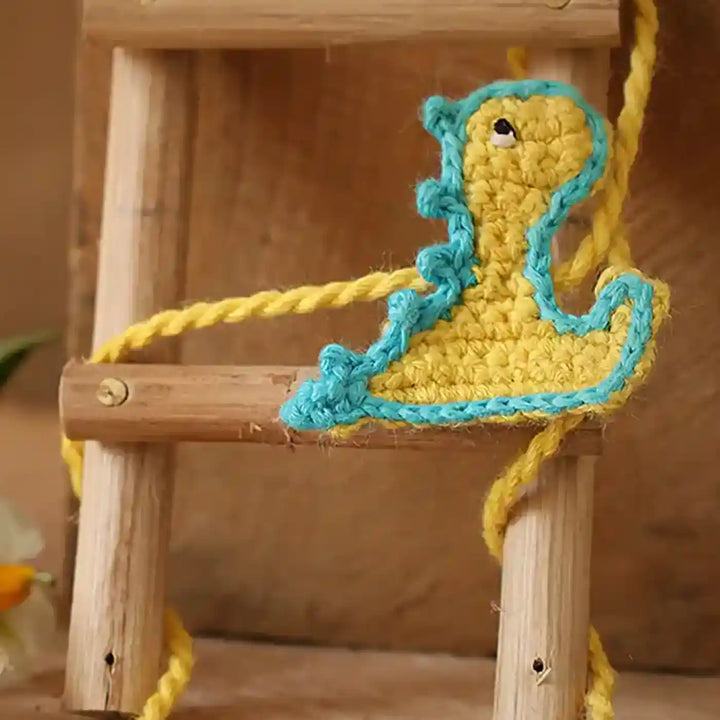 Handmade Crochet Baby Dragon Theme Kids Rakhi And Toy Combo With Roli Chawal Set Of 2 - Ladder Accessory Detail Close-up