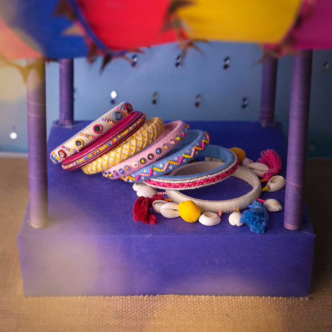 Pastel Handcrafted Navya Beaded Tassel Hanging with Shell Bangles | Set of 7
