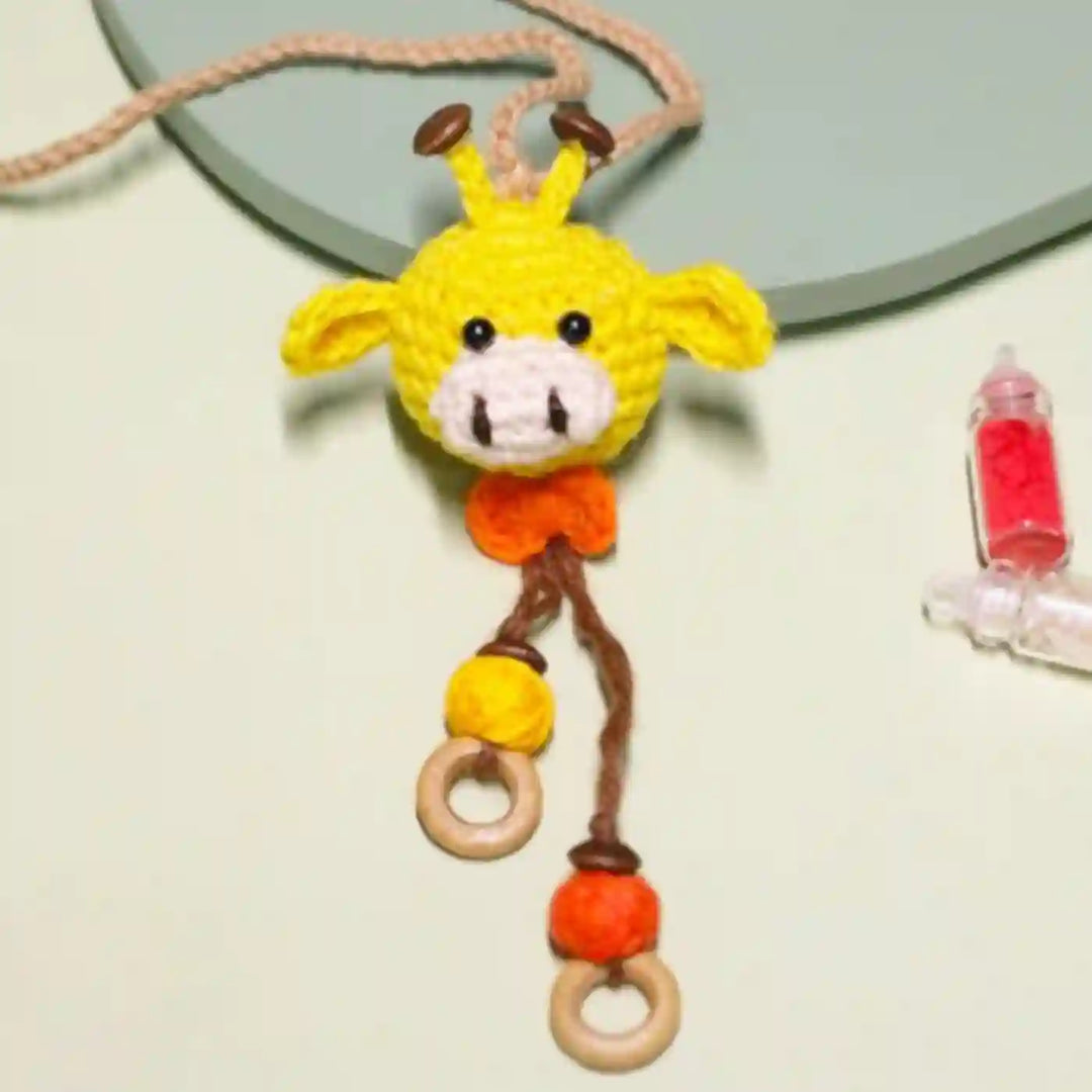 Handmade Crochet Giggling Giraffe Kids Lumba Rakhi For Girls With Roli Chawal - Close-up View