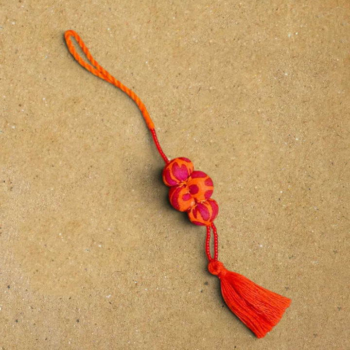 Handmade Kesari Potli Upcycled Fabric Lumba Rakhi for Bhabhi With Roli Chawal