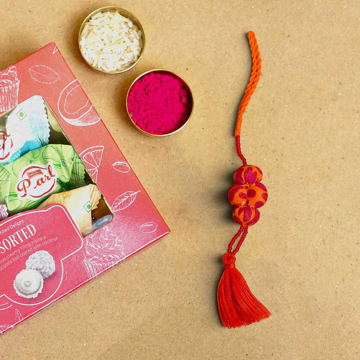 Handmade Kesari Potli Upcycled Fabric Lumba Rakhi for Bhabhi With Roli Chawal