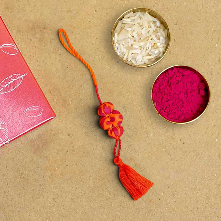 Handmade Kesari Potli Upcycled Fabric Lumba Rakhi for Bhabhi With Roli Chawal