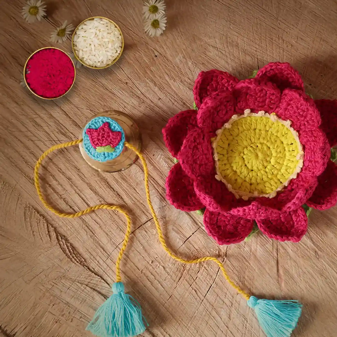 Handmade Crochet Lotus Rakhi And Tealight Holder Combo With Roli Chawal Set Of 2 - Flat Lay with Powder Containers