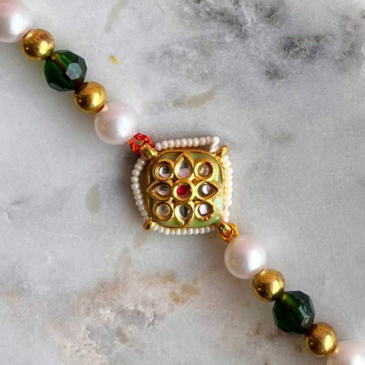 Handmade Golden Flower Design Metal Bhaiya Bhabhi Rakhi - Macro View of Pendant Center