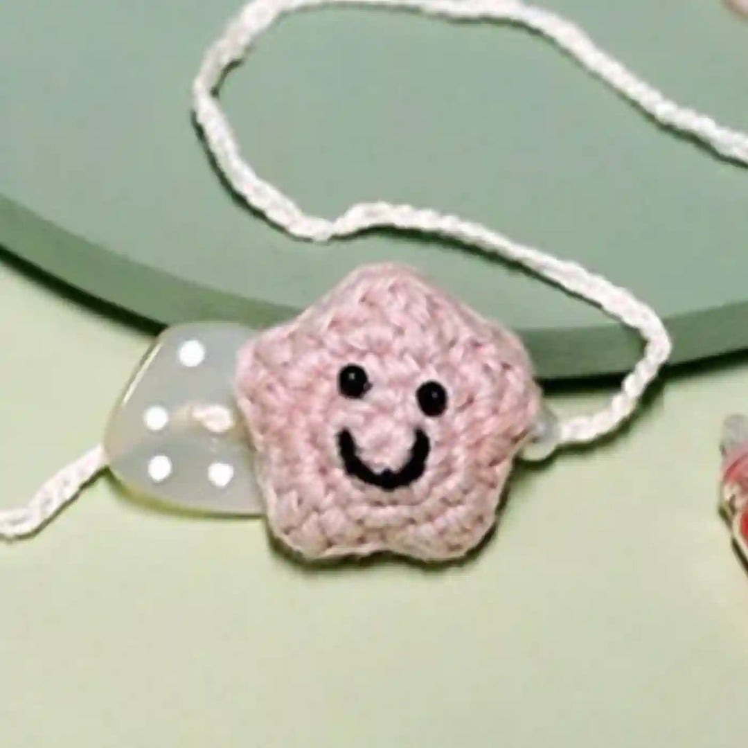 Handmade Crochet Little Star Kids Rakhi With Roli Chawal For Newborns - Pink Star Bracelet Close-up