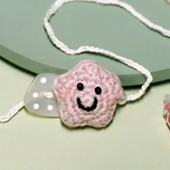 Handmade Crochet Little Star Kids Rakhi With Roli Chawal For Newborns - Pink Star Bracelet Close-up