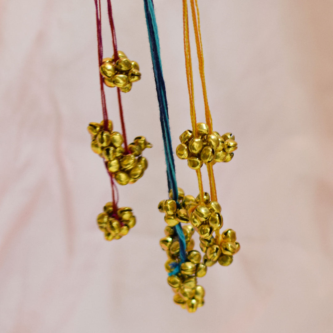 Handmade Swarn Sutra Ghungroo Bhaiya Bhabhi Rakhi With Roli Chawal - Close-up of Bell Clusters Hanging