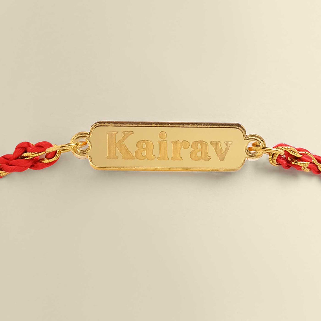 Personalized Handmade Classic Design Acrylic Rakhi - Close-up of Name Engraving